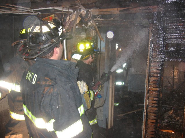 FIREFIGHTERS WET DOWN ANY REMAINING HOT SPOTS BEDFORD  rd HOUSE FIRE